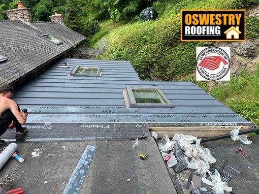 Completed natural slate roof with roof windows by Oswestry Roofing