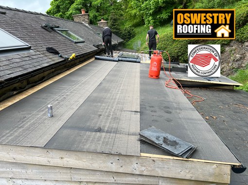 New natural slate lean-to roof installed on a stone outbuilding for roofing work in Oswestry