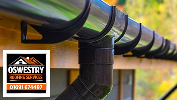Black half-round gutter, brackets and downpipe outlet