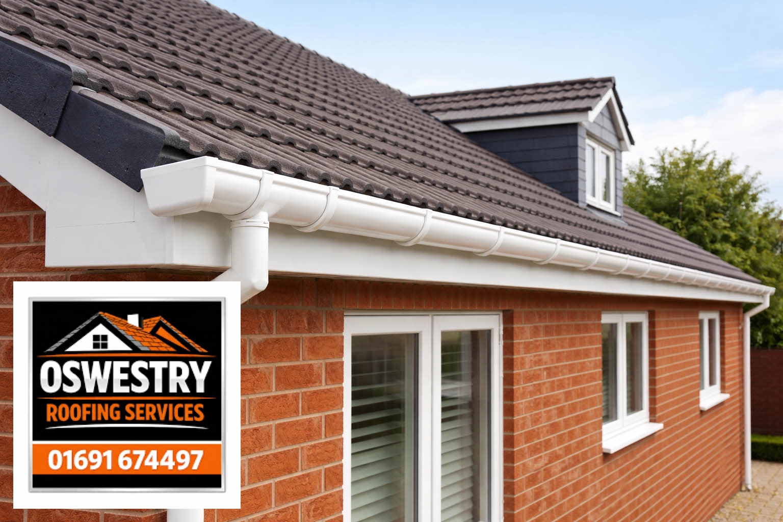 White guttering and downpipe on a brick house