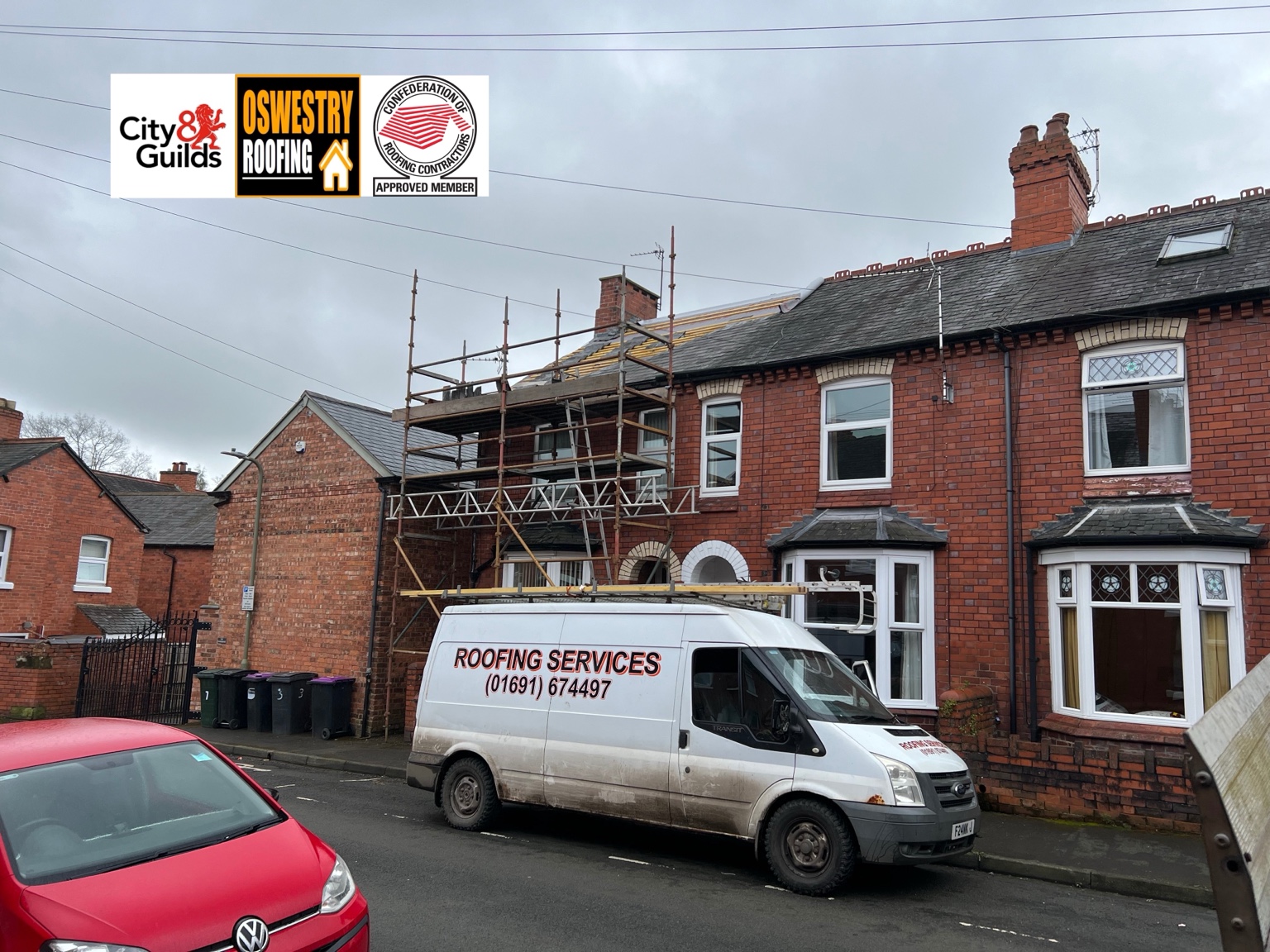 Black guttering, white soffits and fascia boards fitted around a tiled entrance canopy for roofing work in Oswestry
